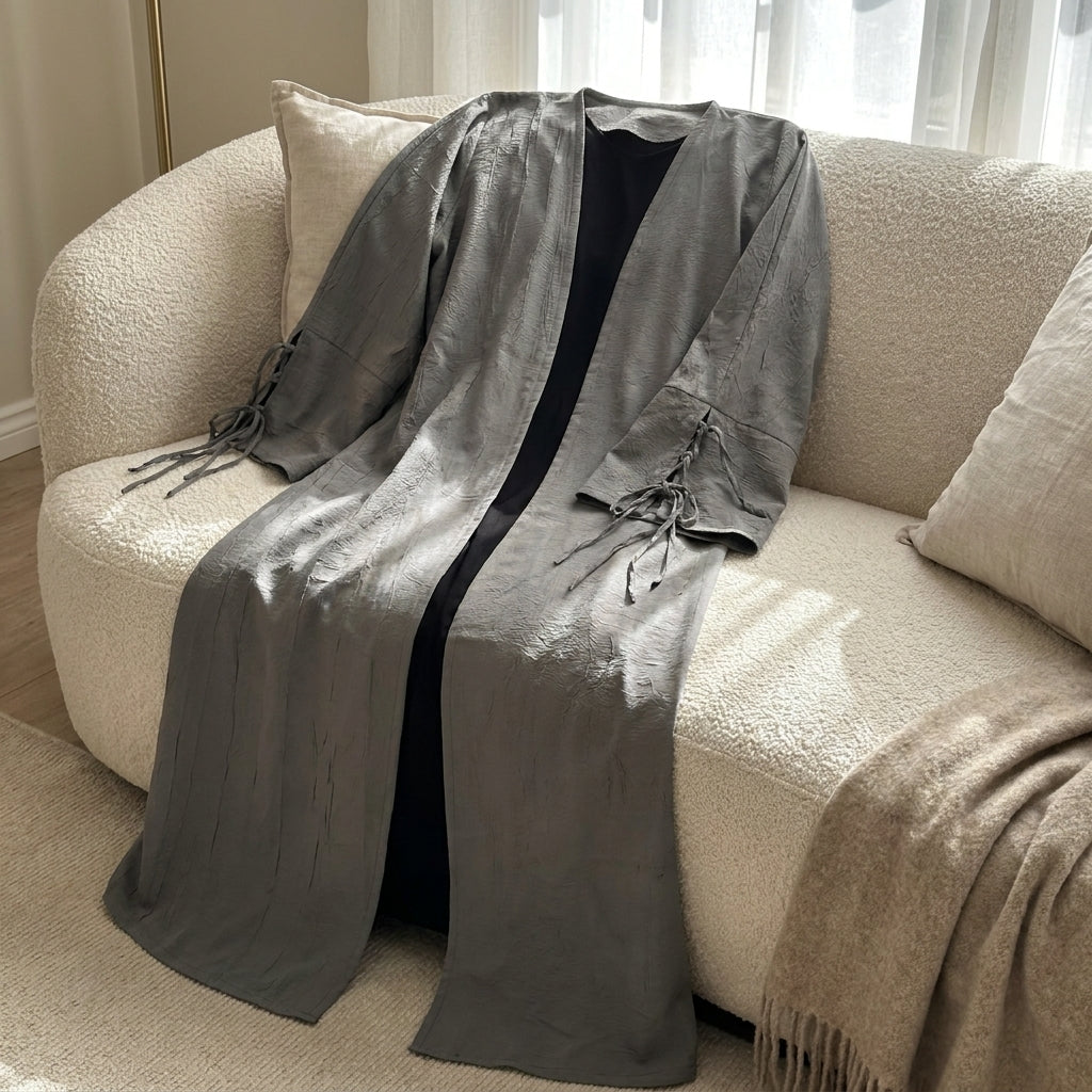 grey-tassel-abaya — sofa